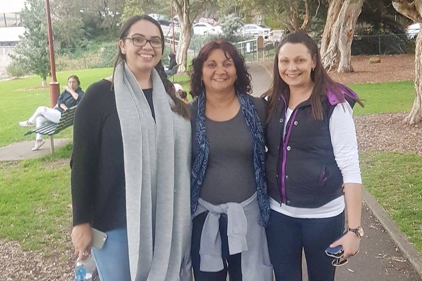 Amanda and her aunty with Amanda's newfound cousin in a park