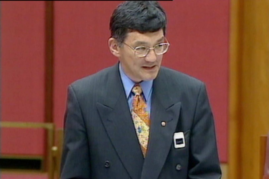 A screenshot from video of Tsebin Tchen delivering a speech in parliament.