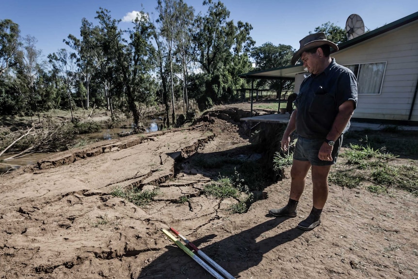 Biloela farmer, Phillip Wilkie, inspects damage at his property.
