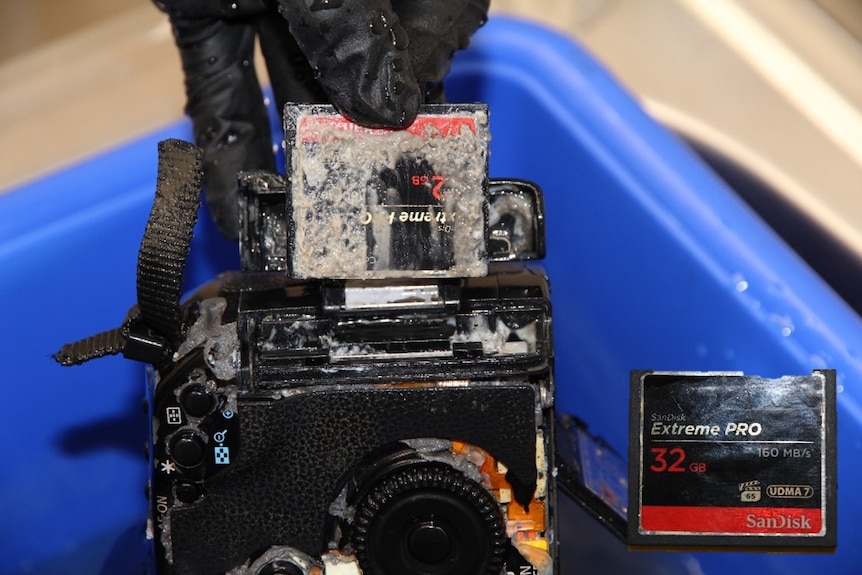 An eroded memory card and a camera