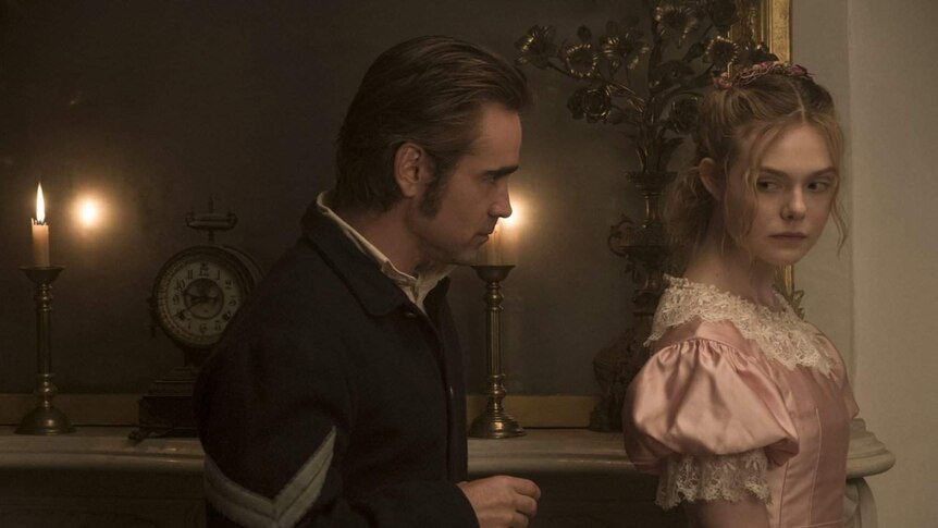 Still image of Colin Firth and Ellen Fanning dressed in Southern Civil War attire in feature film The Beguiled.