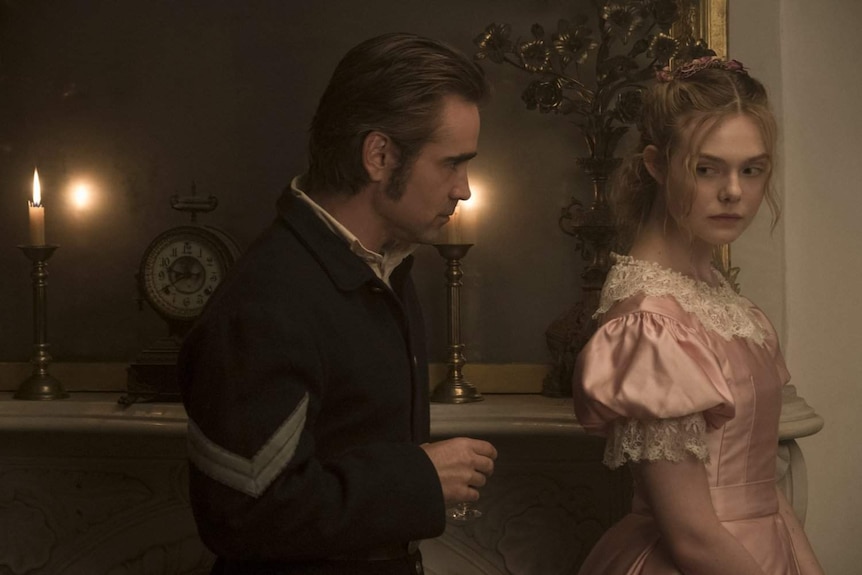 Still image of Colin Firth and Ellen Fanning dressed in Southern Civil War attire in feature film The Beguiled.