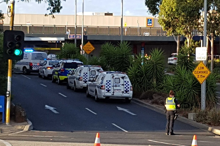 Police cars lined up at the Waverley Gardens shopping centre after reports of a shooting in Melbourne's south-east.