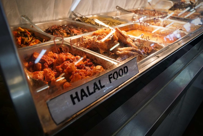 Bain-maries full of Halal food on display at a food court shop