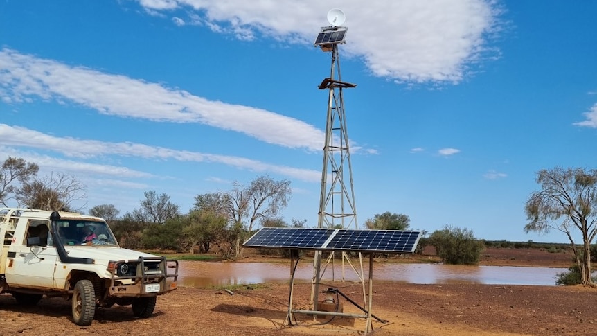 A windmill tower being used to mount remote monitoring equipment 