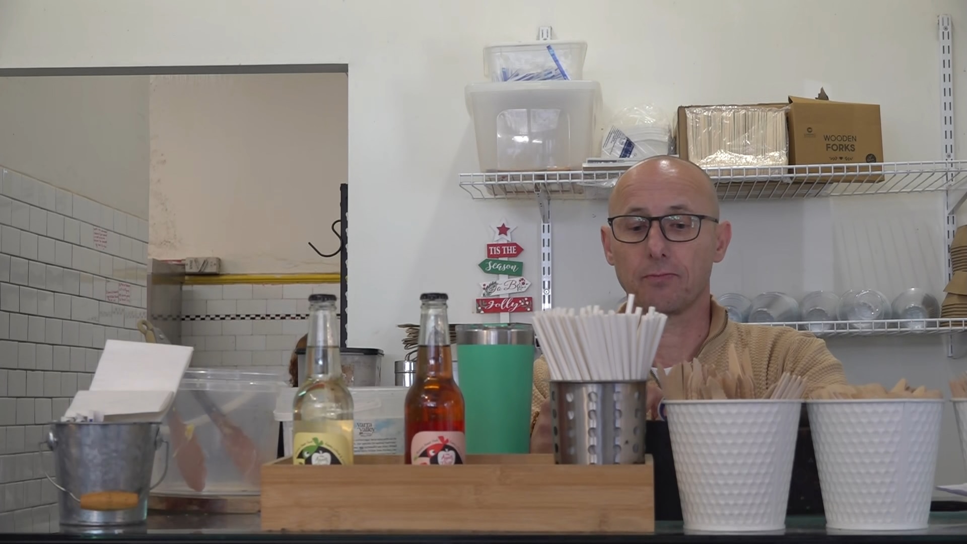 Man working behind a cafe counter