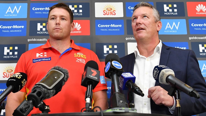 Stuart Dew (left) and Mark Evans (right) are seen during a press conference.