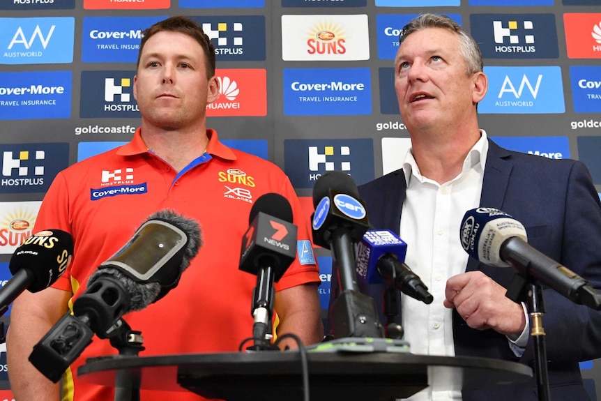 Stuart Dew (left) and Mark Evans (right) are seen during a press conference.
