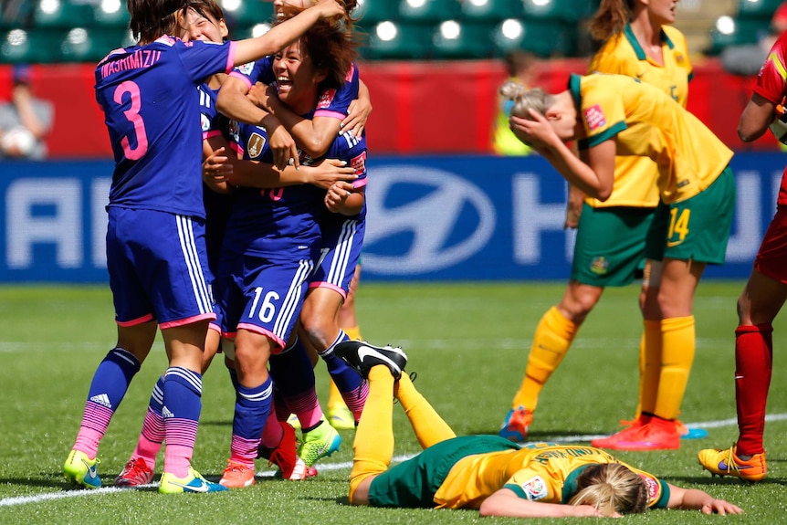 Japan celebrates Man Iwabuchi's game winner in the Women's World Cup quarter-final against the Matildas