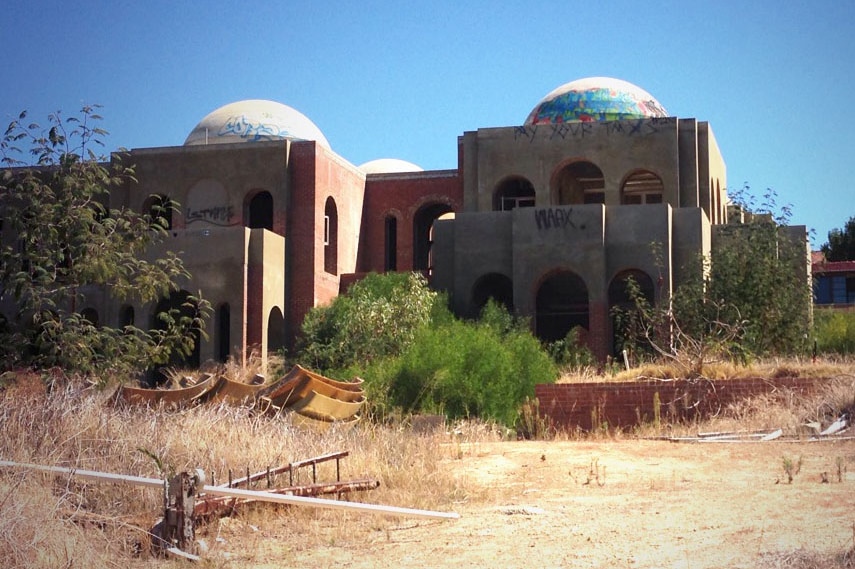 Radhika and Pankaj Oswal's abandoned mansion dubbed Taj Mahal on Swan with graffiti.