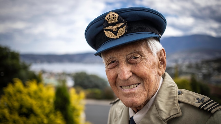 a 101yo war veteran smiles in uniform
