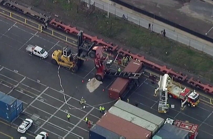 Forklift driver freed after being trapped inside flipped vehicle in