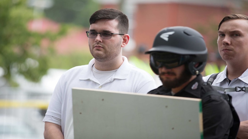 James Alex Fields Jr (left) is seen attending the "Unite the Right" rally in Emancipation Park.