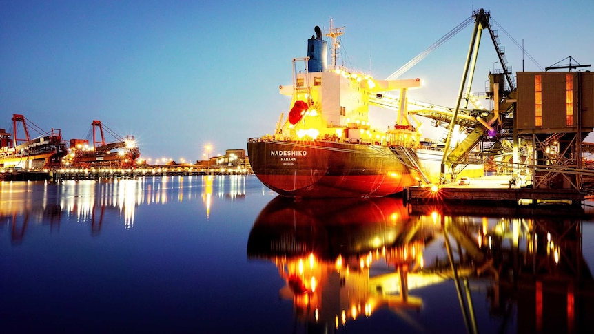 A long-exposure photo of a ship being loaded at the Port Kembla Grain Terminal in New South Wales.