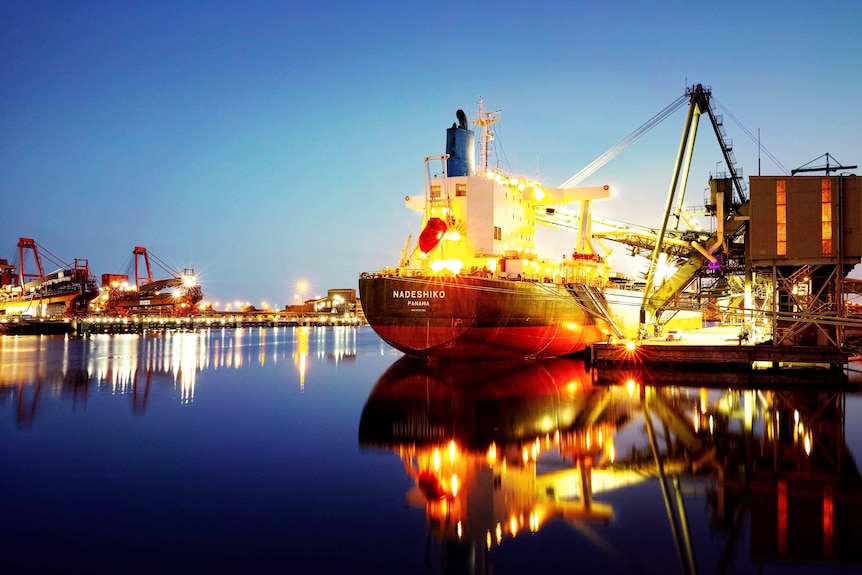 A long-exposure photo of a ship being loaded at the Port Kembla Grain Terminal in New South Wales.