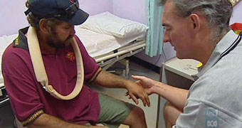 Aboriginal man being treated by doctor