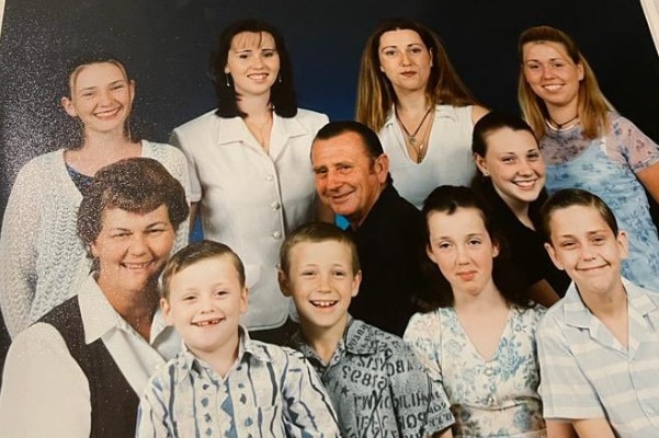 A traditional family portrait from the 1990s