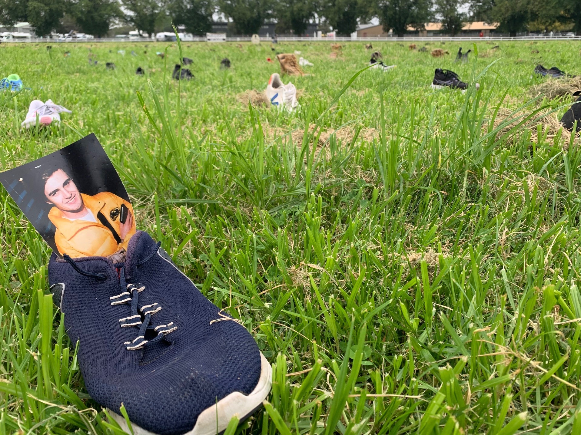 A shoe with a photo of a male inside.