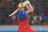Cameron Green plays a slashing cover drive in an IPL game