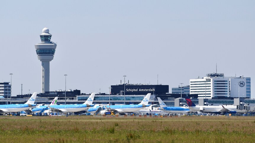 Planes on the tarmac at an airport. 