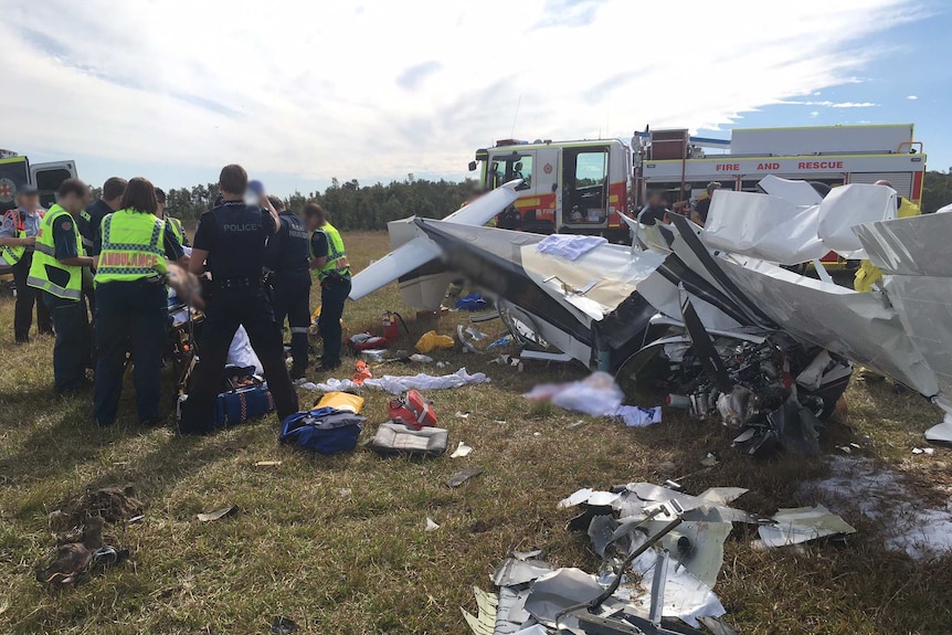 Emergency services tend to victims of a light plane crash at Caloundra