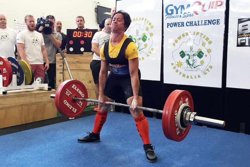 A powerlifting competitor attempts a deadlift at the Canberra event.