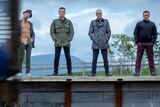 Ewan McGregor, Robert Carlyle, Jonny Lee Miller and Ewen Bremner stand on a train platform