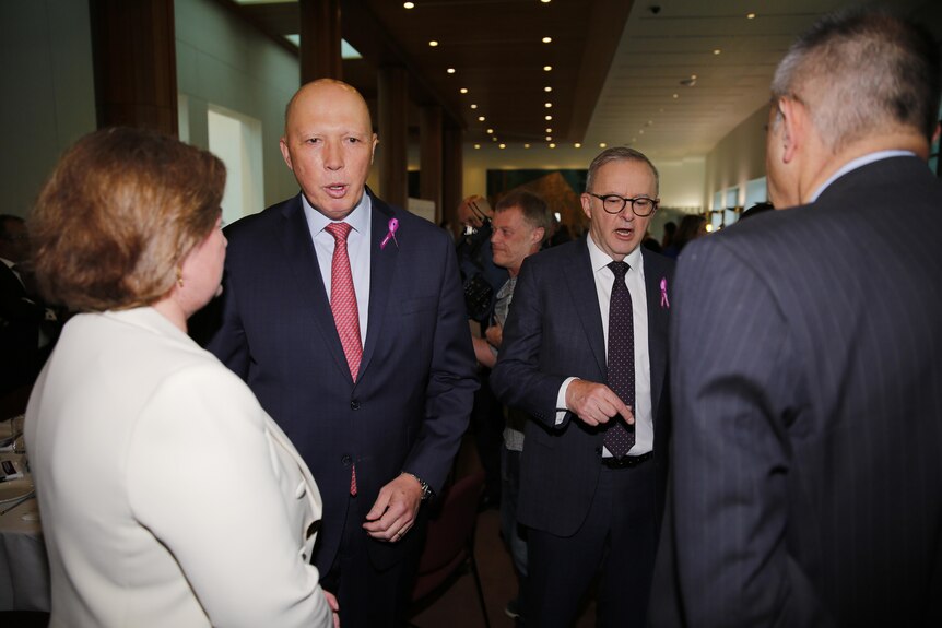 Peter Dutton and Anthony Albanese walking inside Parliament House