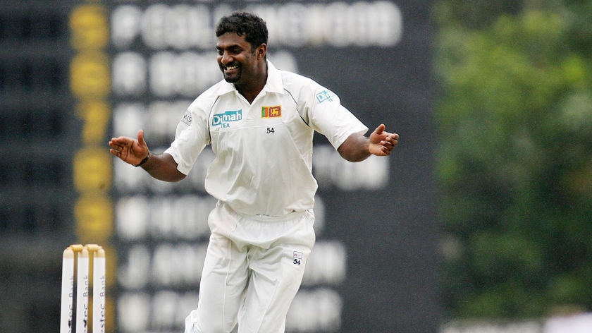 Sri Lankan bowler Muttiah Muralidaran reacts after dismissing England cricketer Ian Bell