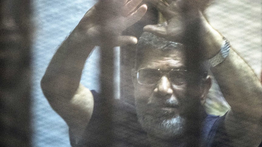 Former Egyptian president Mohammed Morsi in court as death sentence announced