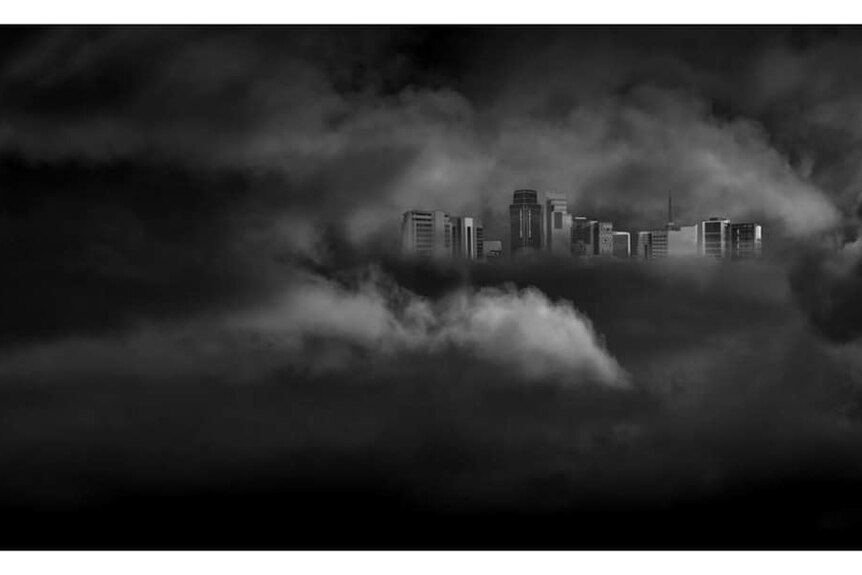 The Perth CBD skyline covered by cloud, black and white.