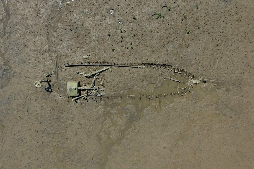 An aerial shot showing the skeleton of a degrading ship.