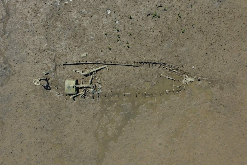 An aerial shot showing the skeleton of a degrading ship.