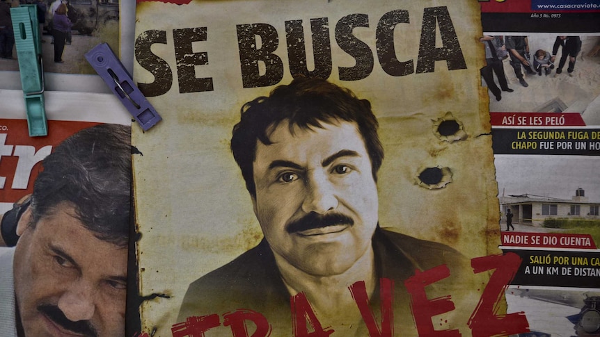 A poster with the face of Mexican drug lord Joaquin "El Chapo" Guzman, reading "Wanted, Again", is displayed at a newsstand in one Mexico City's major bus terminals on July 13, 2015