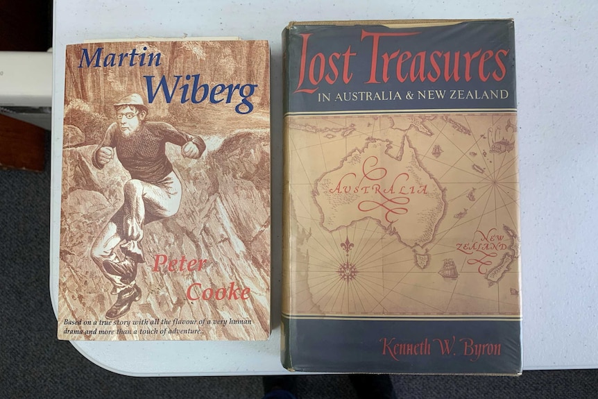 Two books on a desk. One is called "Martin Wiberg" the other is called "Lost Treasures in Australia and New Zealand".