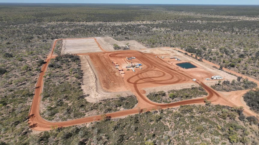 A fracking well in the Beetaloo Basin surrounded by shrubland. 