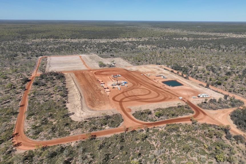 A fracking well in the Beetaloo Basin surrounded by shrubland. 