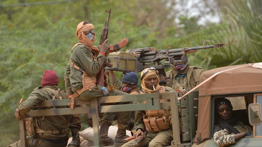 Malian troops patrol Diabaly