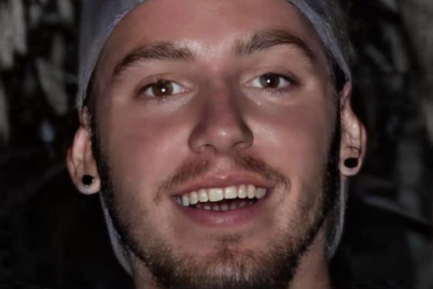 Jack Beasley smiling and wearing a backwards cap.