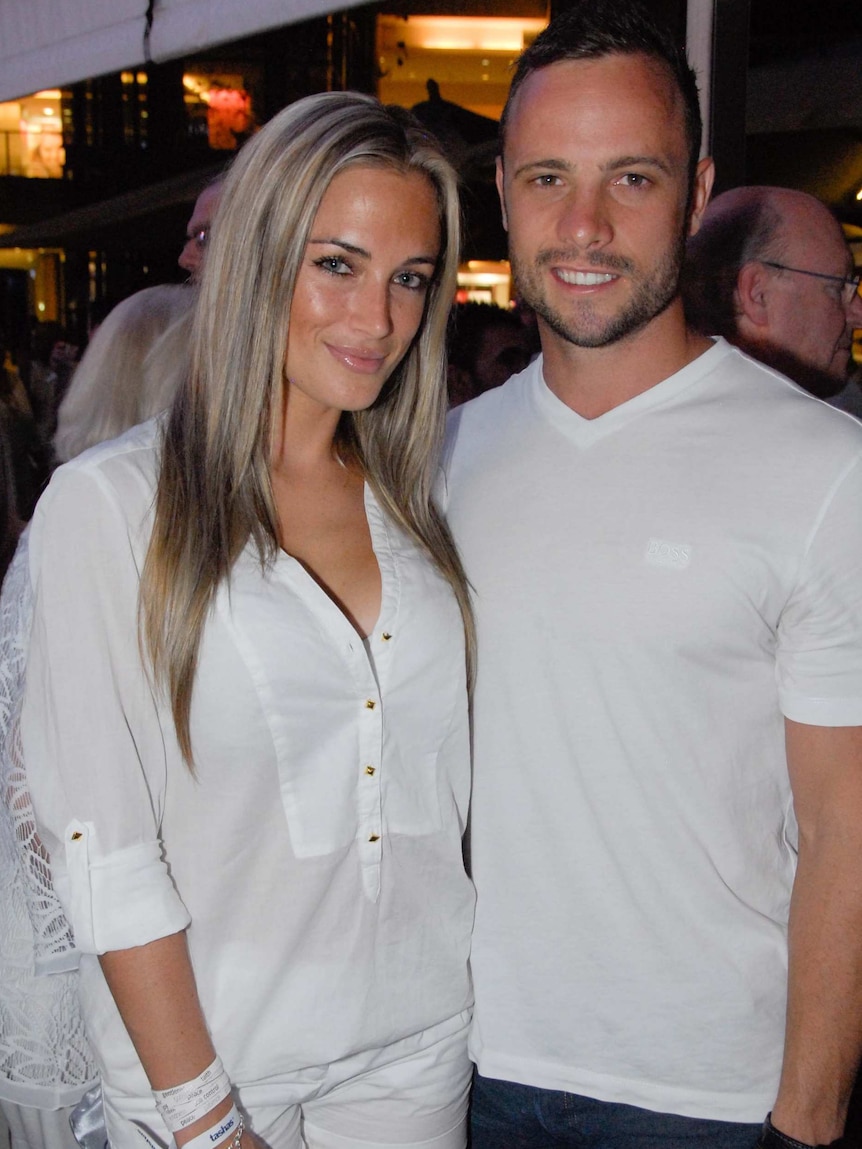 Oscar Pistorius and girlfriend Reeva Steenkamp pose for a photo