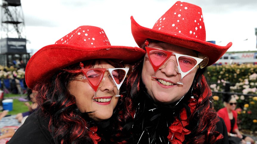 Sue Giles and Wendy McCarthy pose for a photo at Flemington race track.