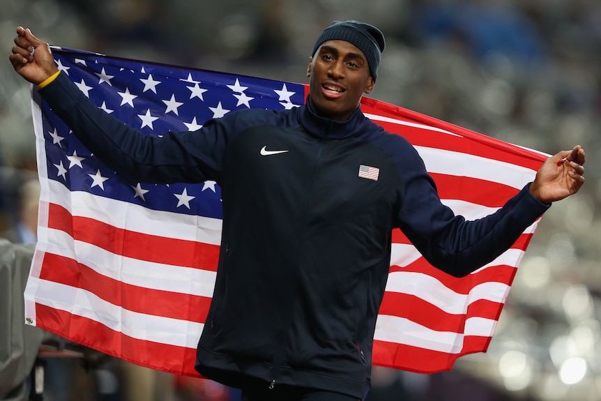 A US high jumper celebrated with the American flag after winning a medal at the London Olympics.