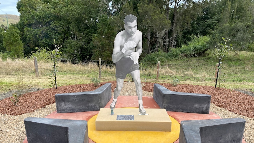 Colourful cement memorial with image of boxer