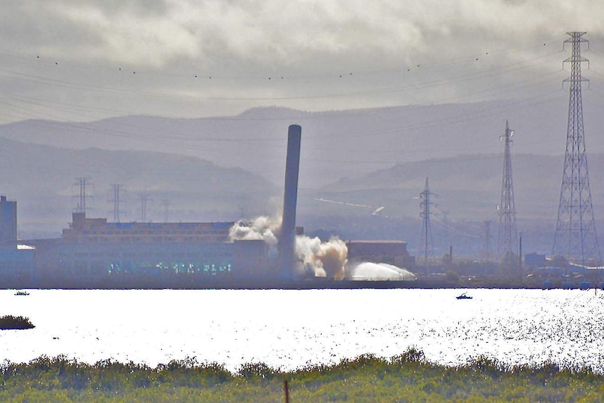 Dust rose as a chimney stack was demolished