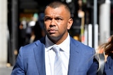 Kurtley Beale outside court wearing a shirt and tie