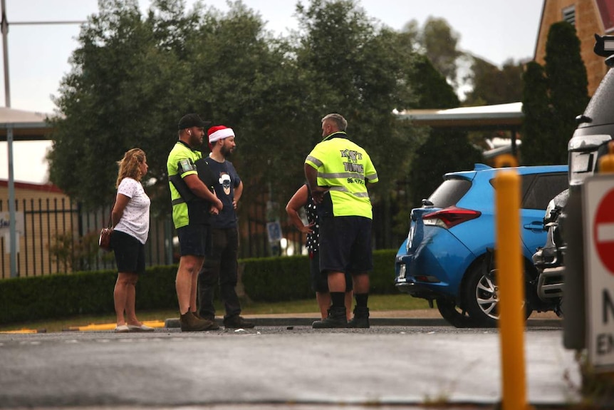 People in a car park