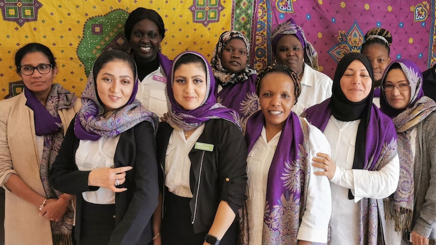 A group of women stands together