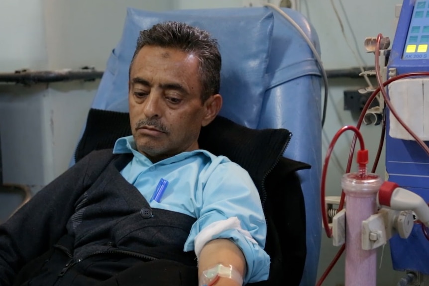 40-year-old Rathwan Alasbahi lies in hospital receiving treatment at a dialysis unit.