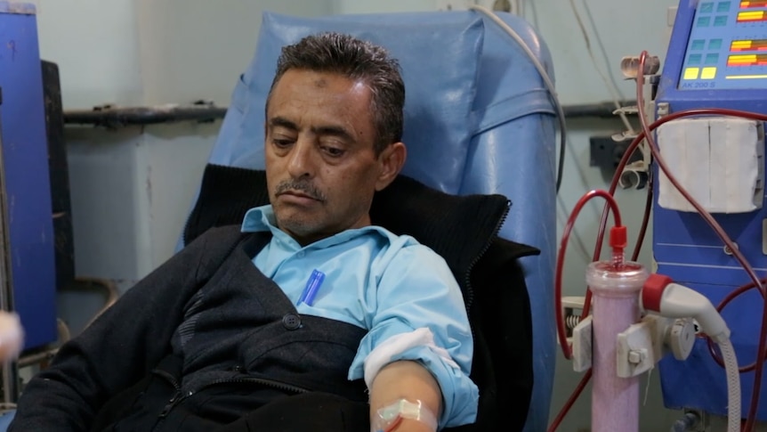40-year-old Rathwan Alasbahi lies in hospital receiving treatment at a dialysis unit.