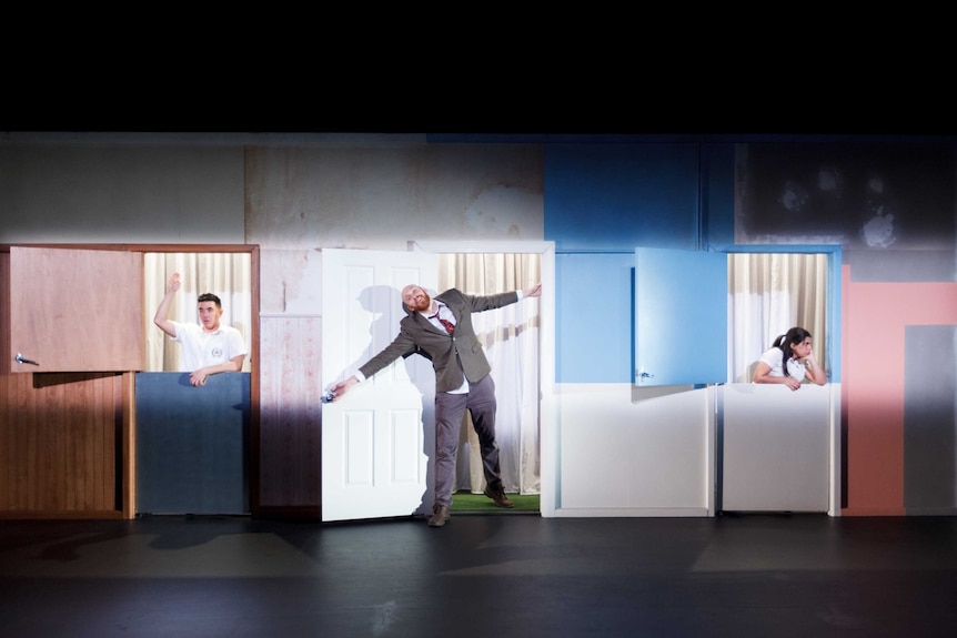 A stage with a big wall and three doors, three actors appear at each door/window